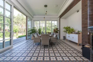 a sunroom with ceramic tiles floor