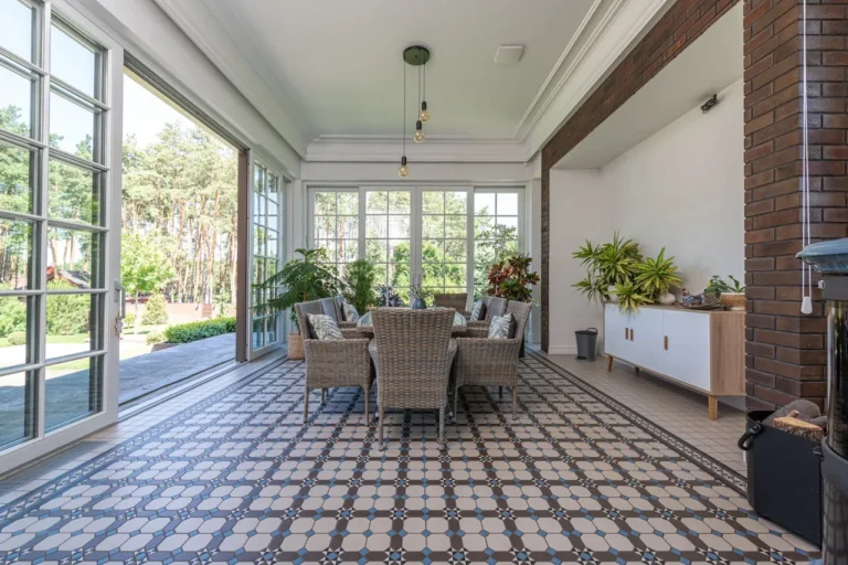a sunroom with ceramic tiles floor