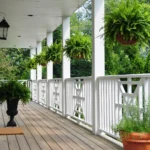 a porch with railing and composite decking