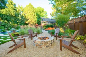 a backyard with pea gravel patio