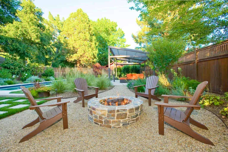 a backyard with pea gravel patio