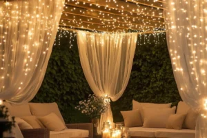 a pergola with string lights and sheer curtains