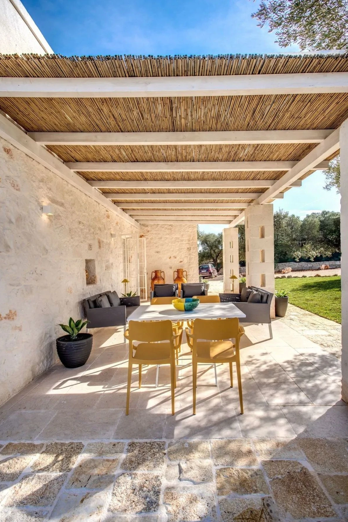 a pergola with reed roofing