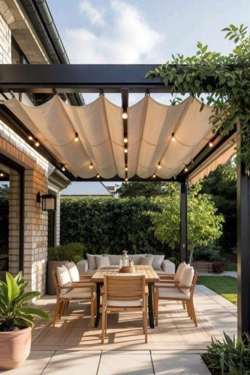a pergola with retractable fabric canopy roof